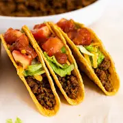 Taco Bell Classic Taco with seasoned beef, lettuce and shredded cheese in a crispy shell