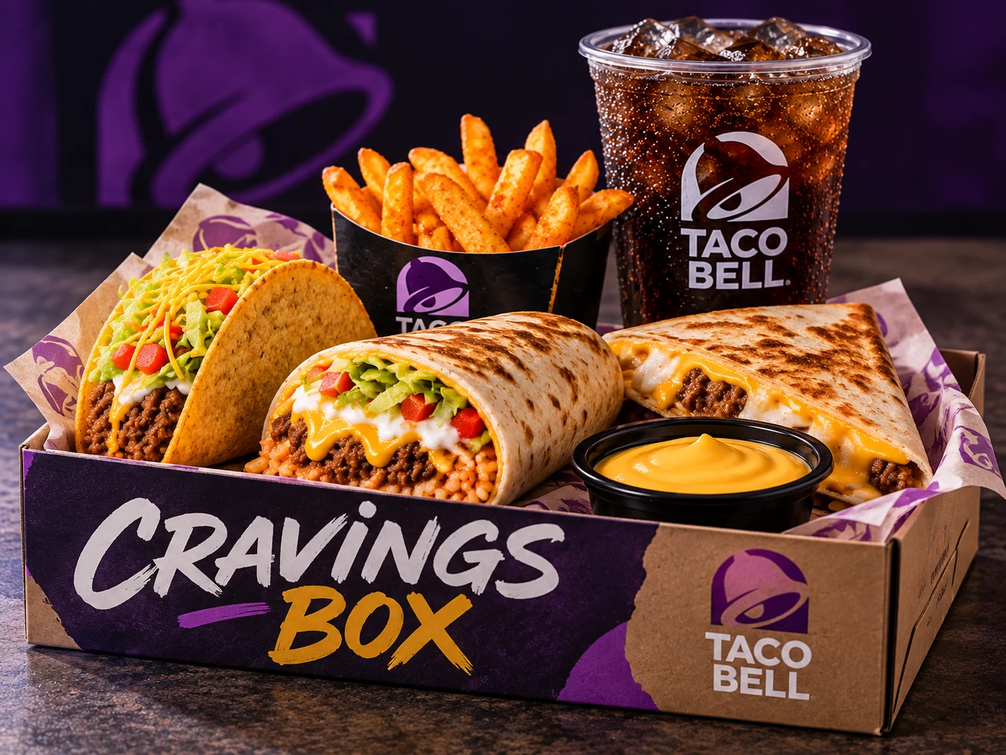 Taco Bell Cravings Box with crunchy taco, burrito, fries, nacho cheese and cold drink